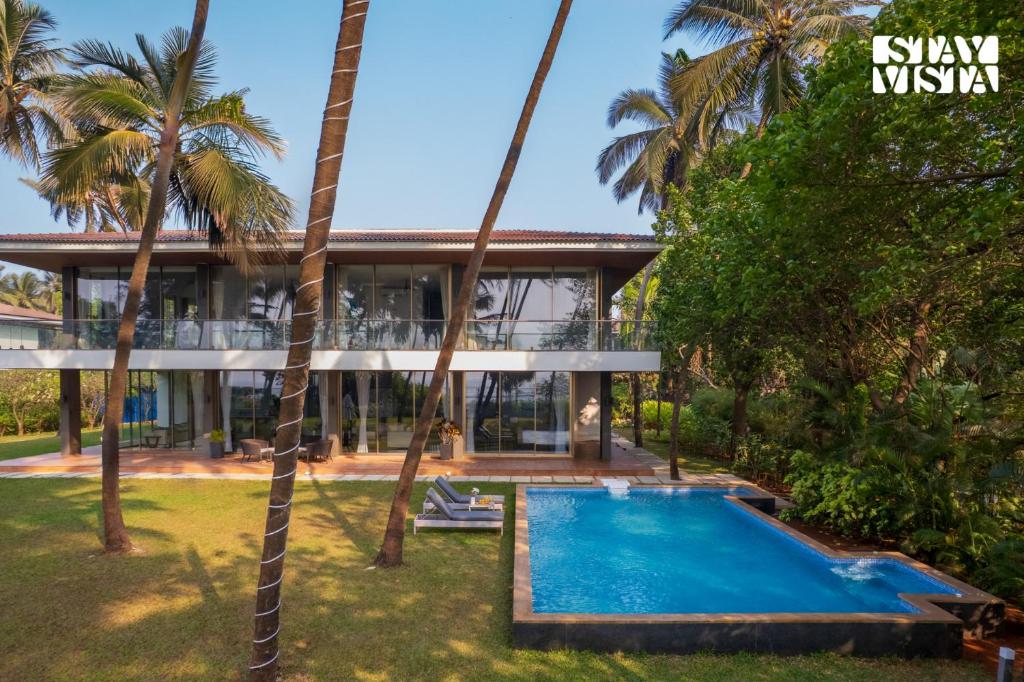StayVista at Sapphire Shores Beachfront Villa with Lawn, Pool