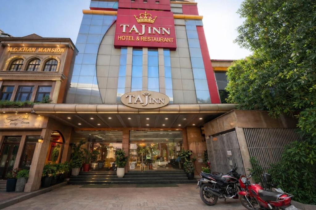 a motorcycle parked in front of a building at Taj Inn Hotel in Agra