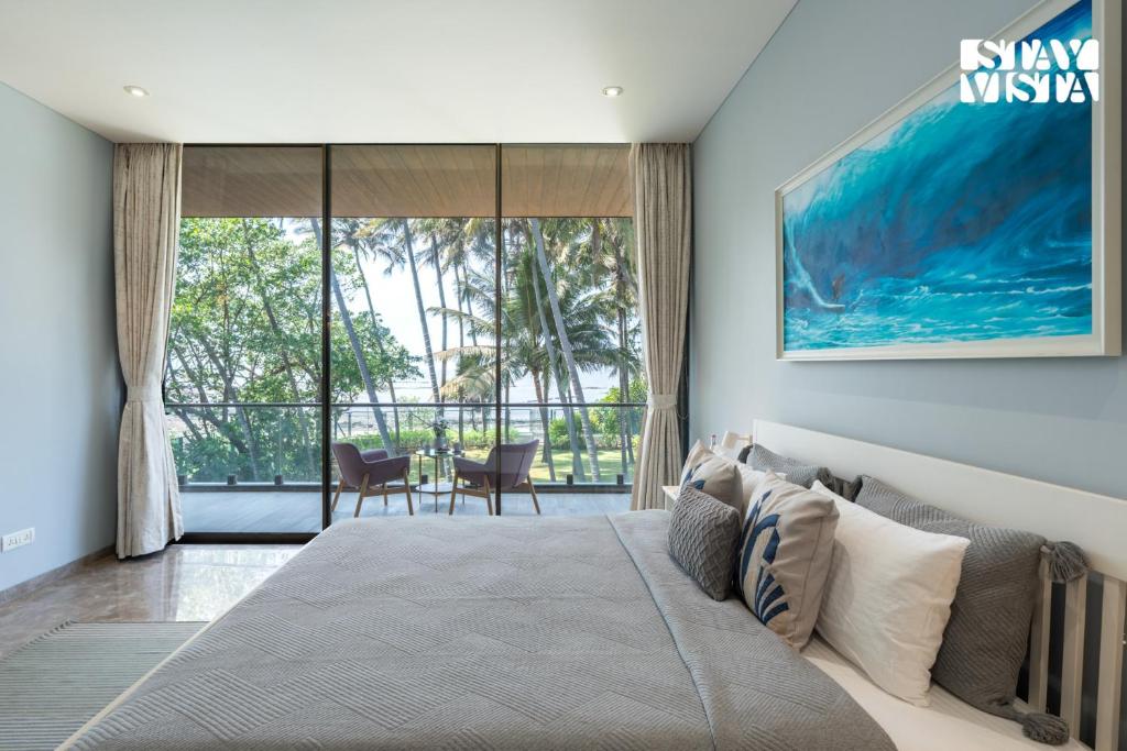 StayVista at Sapphire Shores Beachfront Villa with Lawn, Pool