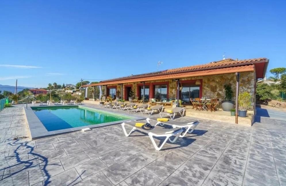 a villa with a swimming pool and a house at Bravaholidays-625-Silence in Terra Brava