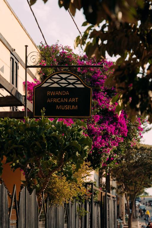 a sign for the rivanandan american art museum at Rwanda African Art Museum in Nyabisindu