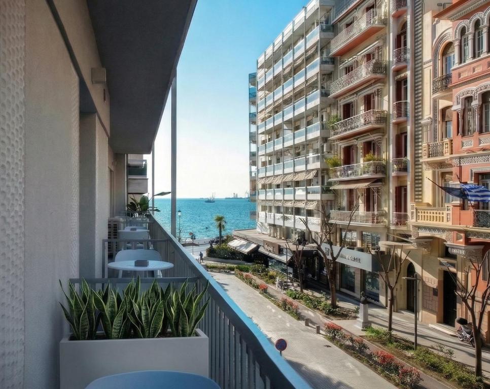 a balcony with a view of the ocean at Pillow by the Sea in Thessaloniki