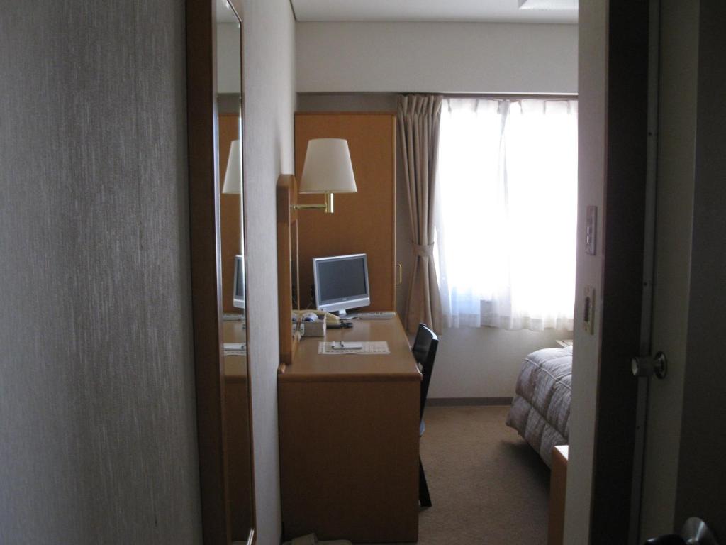 TV a/nebo společenská místnost v ubytování Mito Riverside Hotel