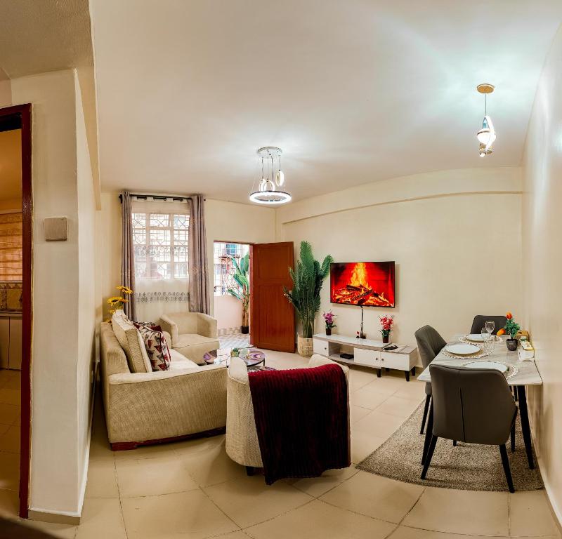 a living room with a couch and a table at Chuma's home in Arusha