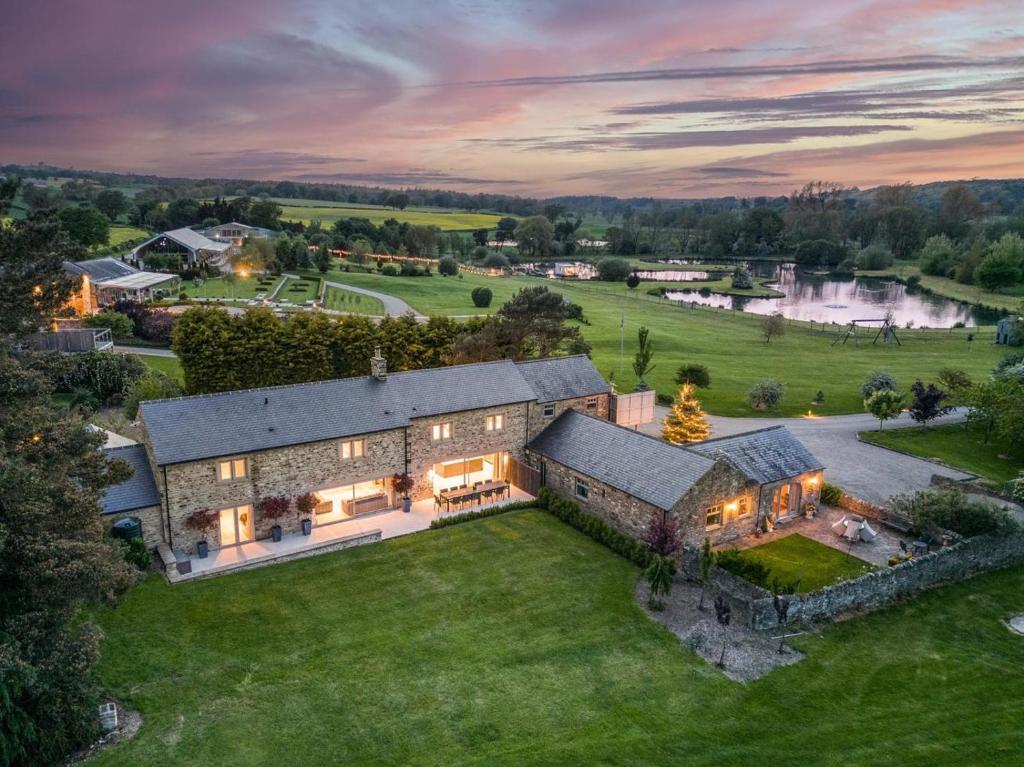 an aerial view of a large house with a yard at 6 Bed in Richmond oc-80466 in Gilling
