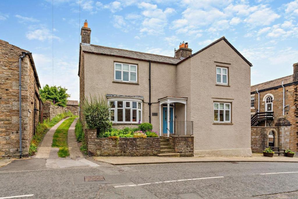 a large brick house on the side of a street at 3 Bed in Askrigg oc-h29661 in Askrigg