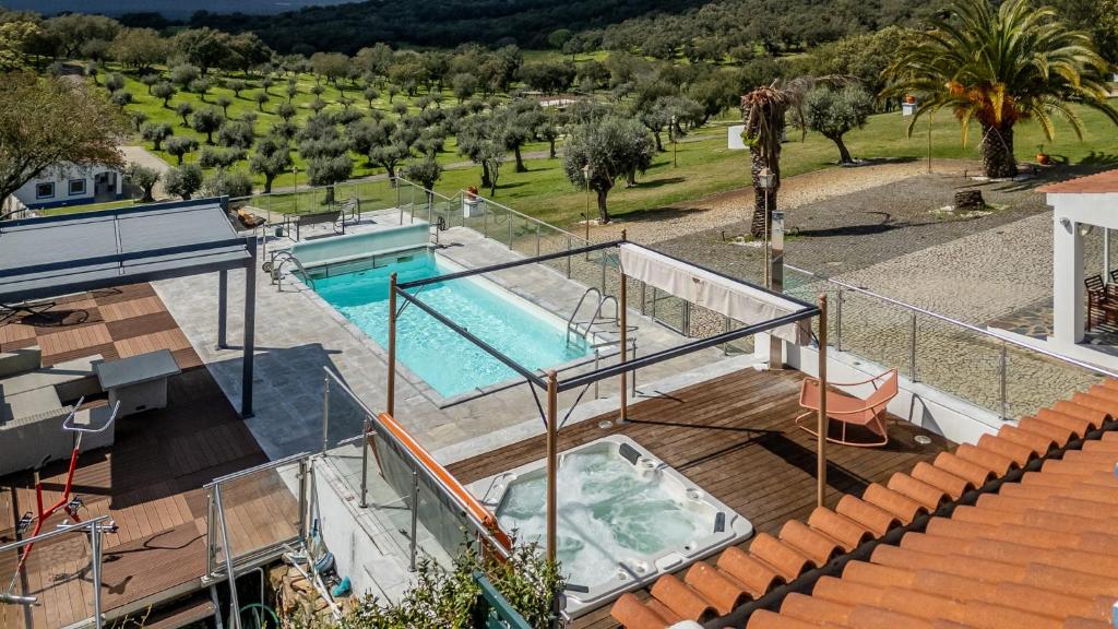 an overhead view of a swimming pool in a house at Monte da Pechincha - Casa de Hóspedes & Spa in Estremoz
