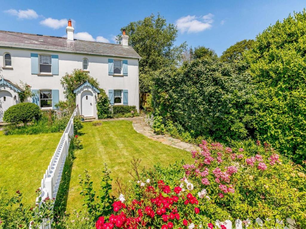 an exterior view of a house with a garden at 2 Bed in Sway oc-nfl43 in Sway