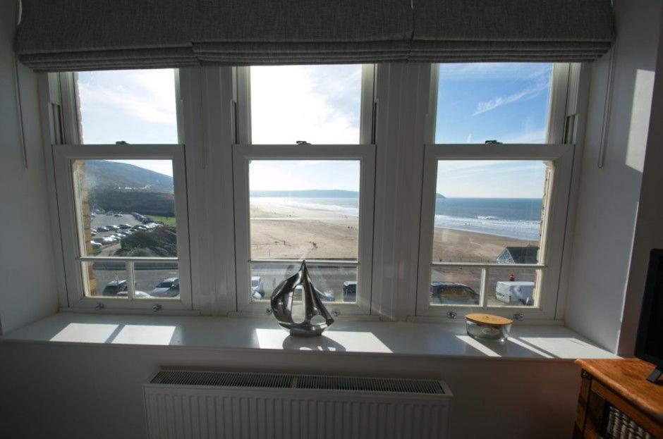 a window with a view of the ocean in a room at Oceanview in Woolacombe