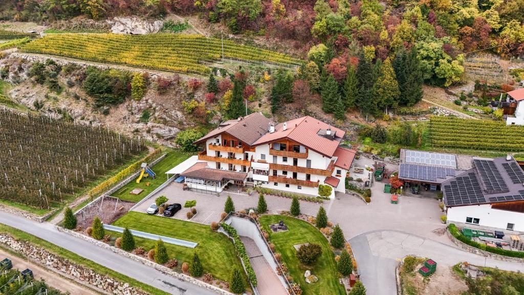 an aerial view of a house in a vineyard at Residence Fallrohrhof in Naturno
