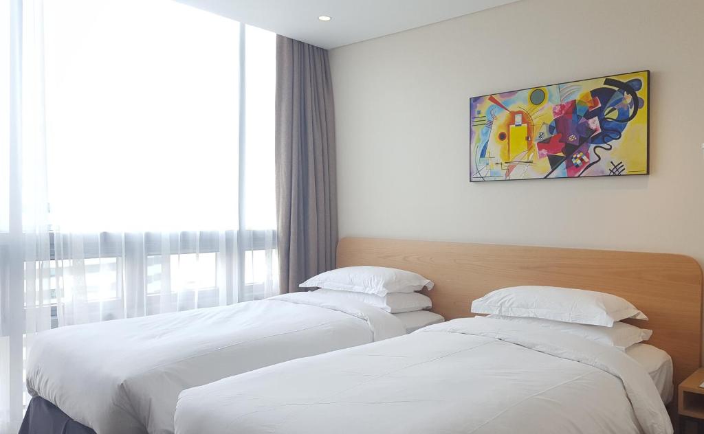 Postel nebo postele na pokoji v ubytování Best Western Haeundae Hotel