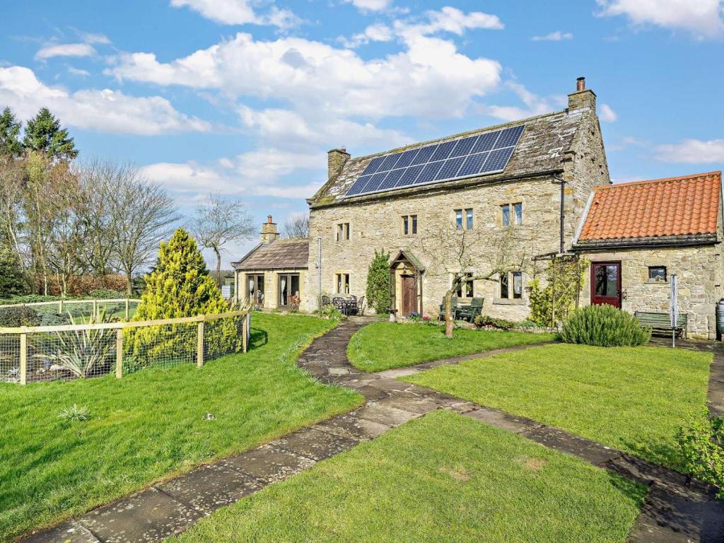 an old stone house with solar panels on the roof at 3 Bed in Richmond oc-91578 in Caldwell