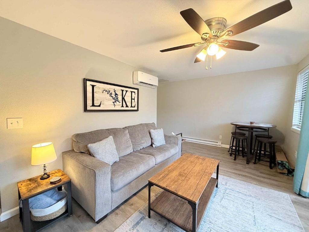 a living room with a couch and a ceiling fan at A Frame Escape Lake Access in Rocky Mount