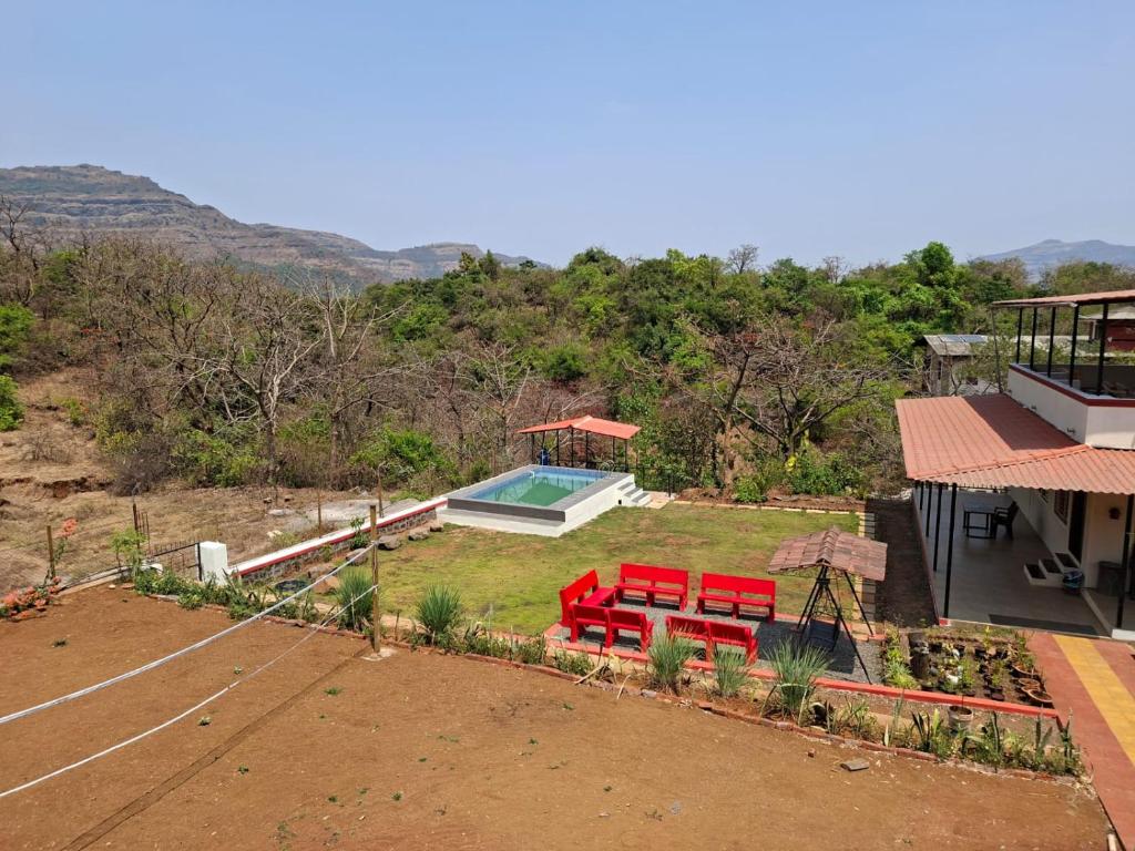 an aerial view of a house with a pool at Girijalsrushti Pool Villa in Kolvan
