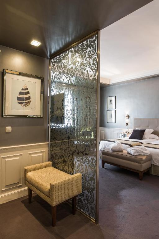 Postel nebo postele na pokoji v ubytování Hotel Carlton