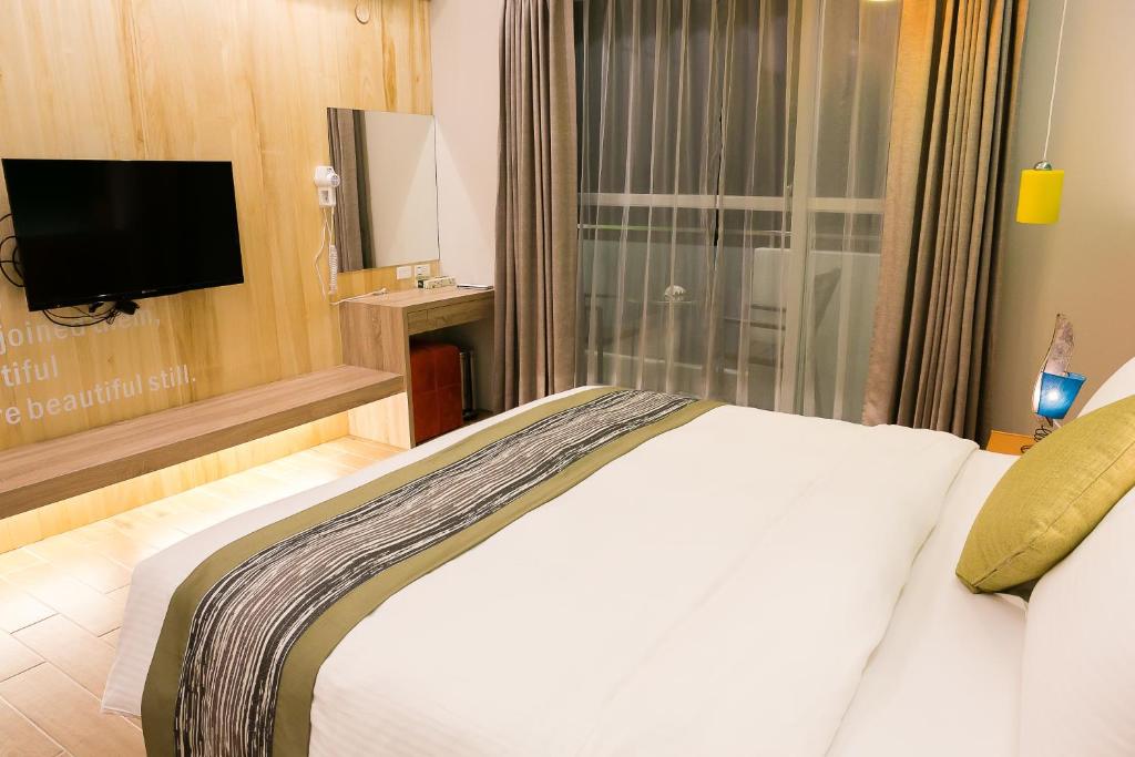TV a/nebo společenská místnost v ubytování Bai Sha Tan Cottage