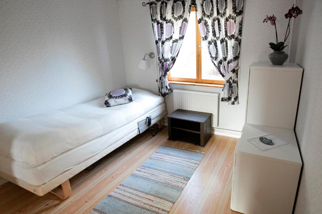 Postel nebo postele na pokoji v ubytování Mellangården