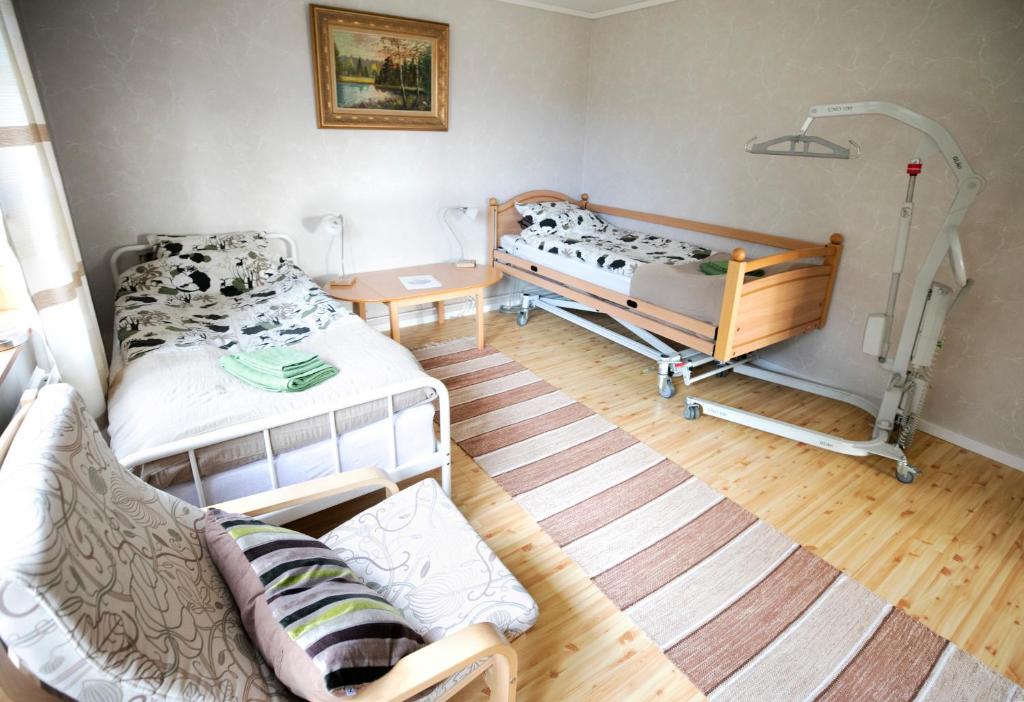 Postel nebo postele na pokoji v ubytování Mellangården