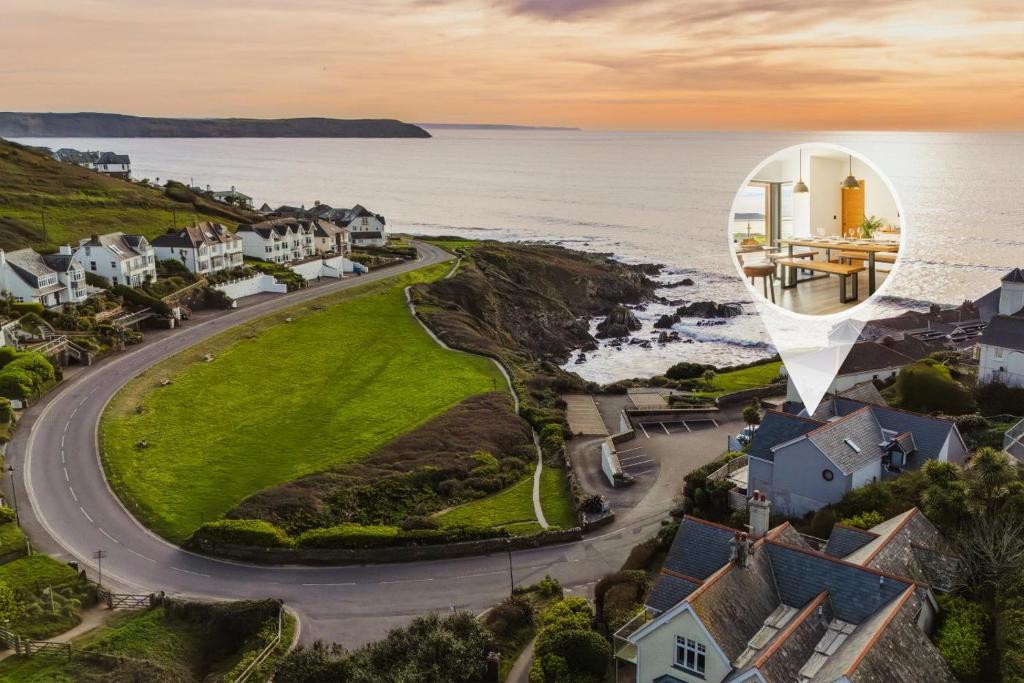 an aerial view of a village with the ocean and houses at 5 Bed in Mortehoe oc-c30855 in Mortehoe