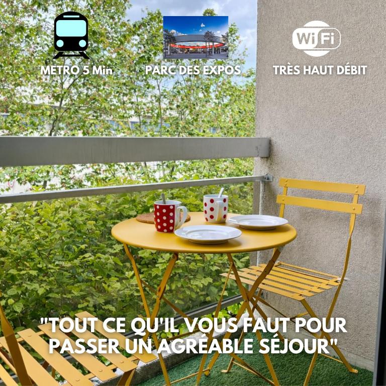 a table with two cups and plates on a balcony at Relax-Parc des expos-Wifi by La clé des expos in Vanves