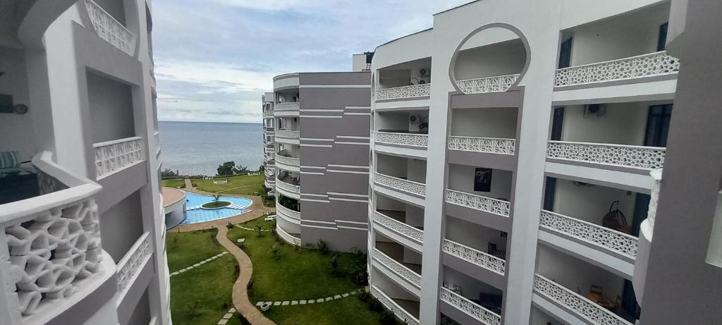 an apartment building with a view of the ocean at Easy stays baobab in Mombasa
