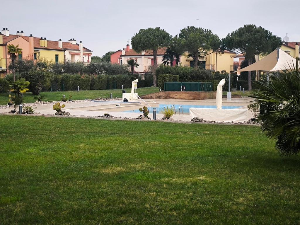 a park with a skate park with a swimming pool at Good Time house in Aprilia Marittima