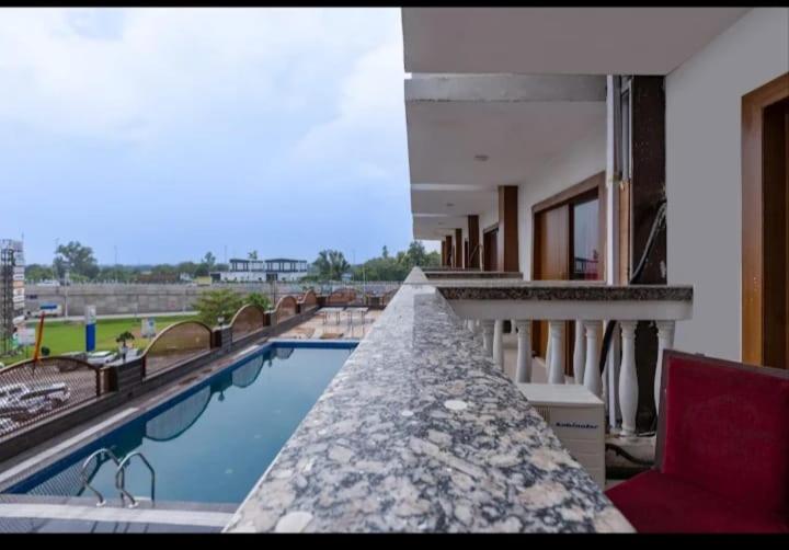 a view of a swimming pool on top of a building at Hotel Lotus Paradise in Sonīpat