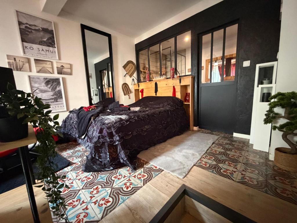 a bedroom with a bed and a rug at Magnolia duplex in Canet