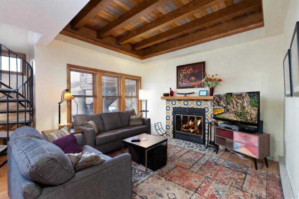 a living room with a couch and a fireplace at 2 2 Ferringway 17 in Durango