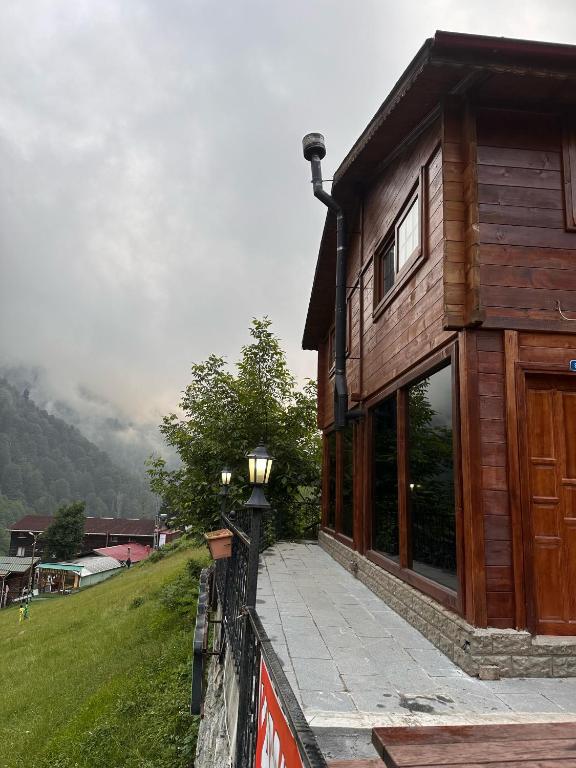 a building with a light on the side of it at Ayder Villa Bravo in Çamlıhemşin