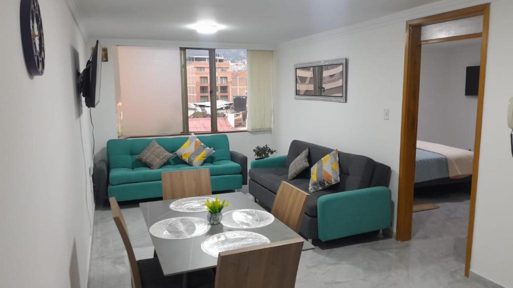 a living room with a couch and a table at El Encanto in Duitama