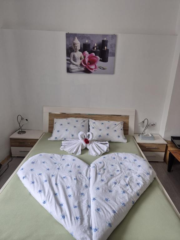 a bedroom with a bed with a bow on it at Alte Post - Sonne in Gurk