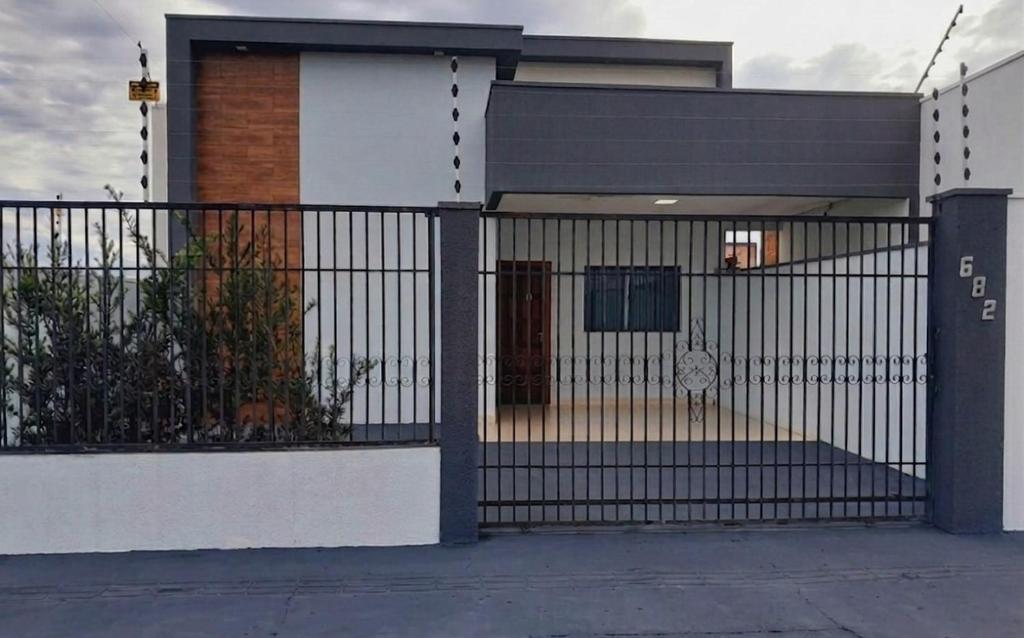 a house with a black and white wrought iron gate at 3 A A a in Sinop