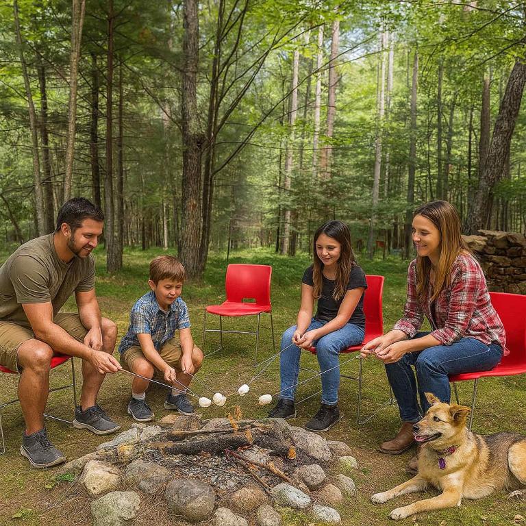 a family sitting around a fire with a dog at Brandy Bay Hideaway: Pet Friendly Retreat in Arbor Vitae