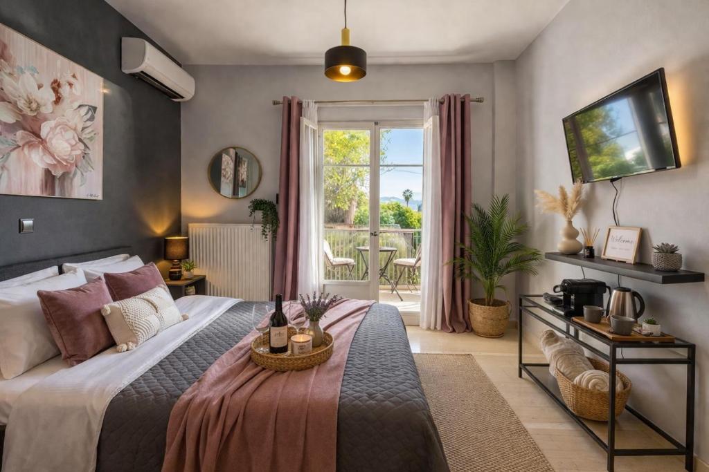 a hotel room with a bed and a balcony at Ilios Place Corfu-Near Old Town & Beaches in Kontokali