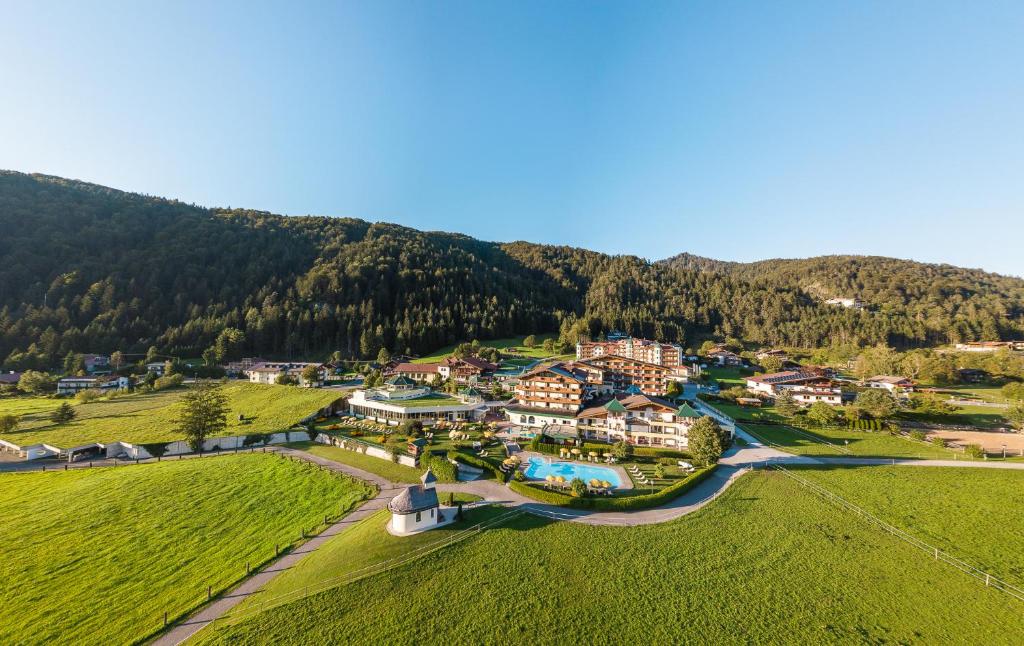 an aerial view of a resort in the mountains at Hotel Seehof in Walchsee