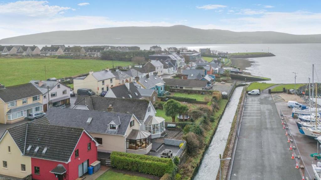 a small town with houses and a body of water at 3 Bed in Dingle oc-ii05995 in Dingle