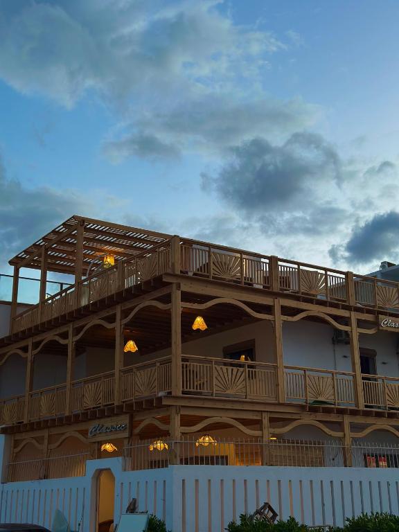 a building with a deck on the side of it at Classic Home DaHaB in Dahab
