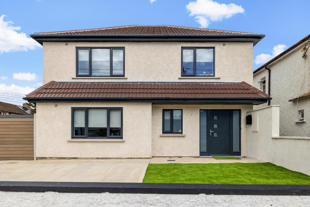 a brick house with a brown roof at North Dublin Premier Oasis in Dublin