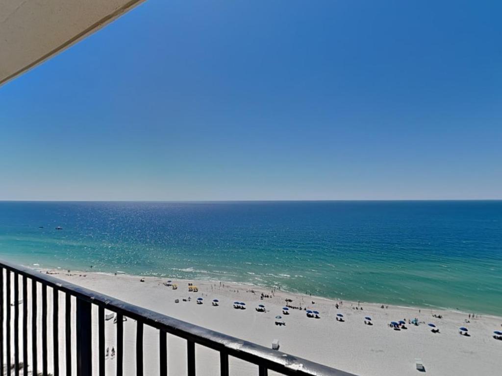 a view of a beach with chairs and the ocean at Phoenix III #3146 in Orange Beach