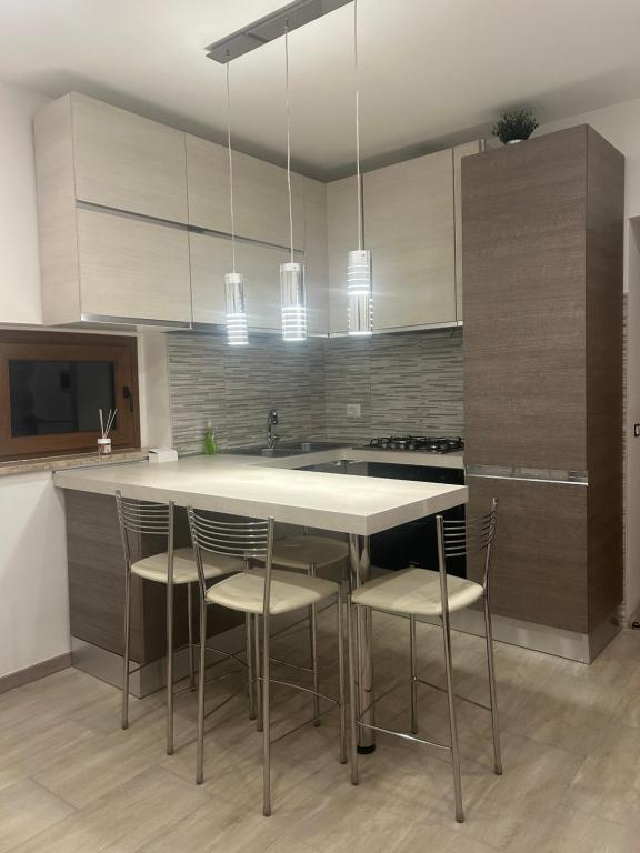 a kitchen with a table and chairs in it at Boffi house in Sezze