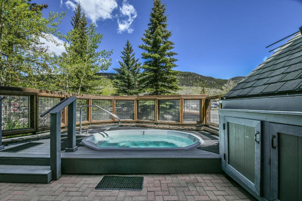 a hot tub on the deck of a house at Buffalo Lodge 8411 by SummitCove Lodging in Colorado in Keystone