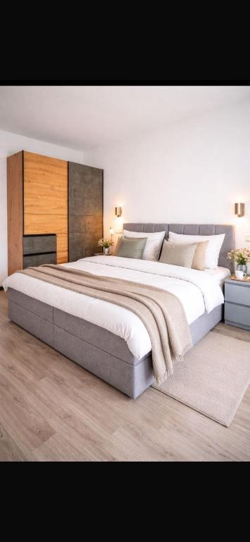 a large bedroom with a large bed in it at La Casa Motel in Schaafheim