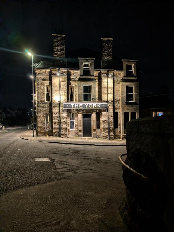 a building with a sign that reads the york at night at THE YoRK in Morecambe