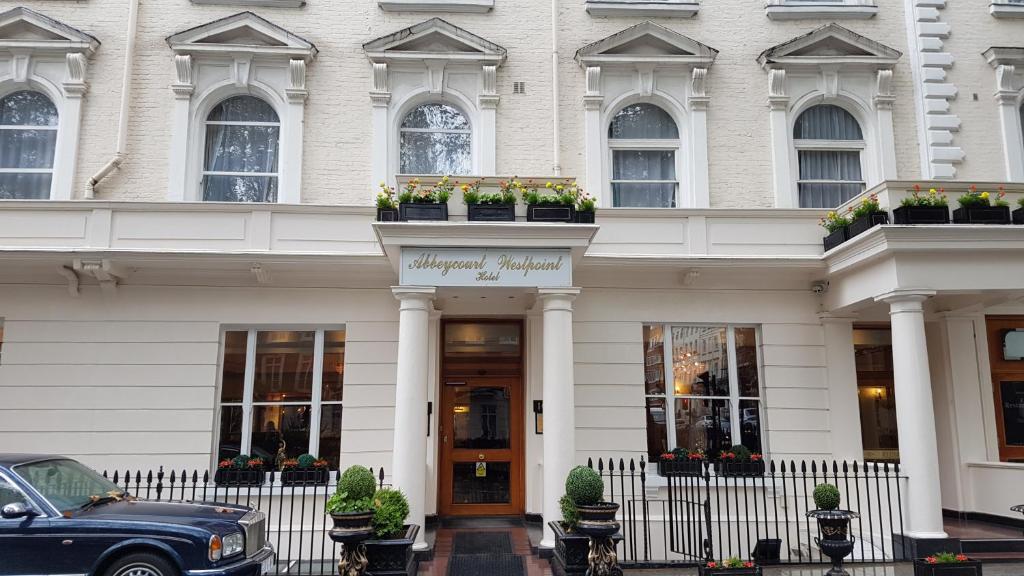 a black car parked in front of a building at Westpoint Hotel in London