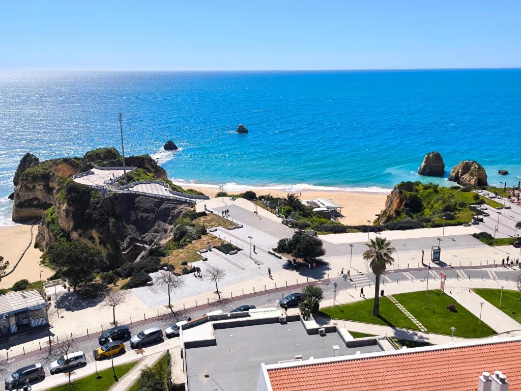 a view of a beach and the ocean at Seaview Varandas do Sol 2 in Portimão
