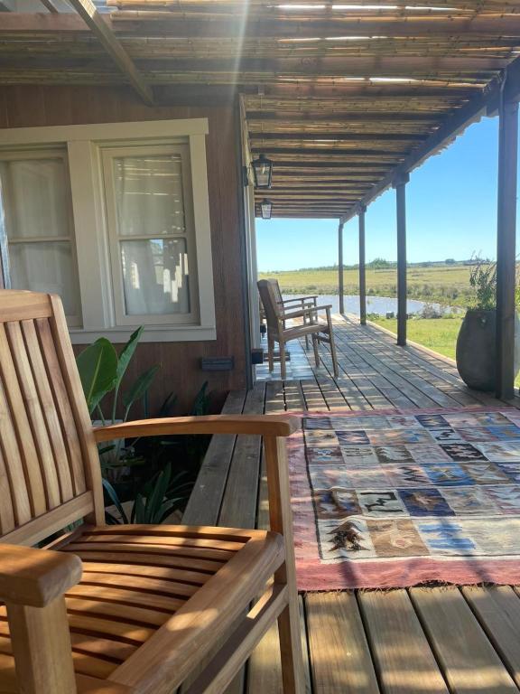 a deck with chairs and tables on a house at eastwood in San Carlos