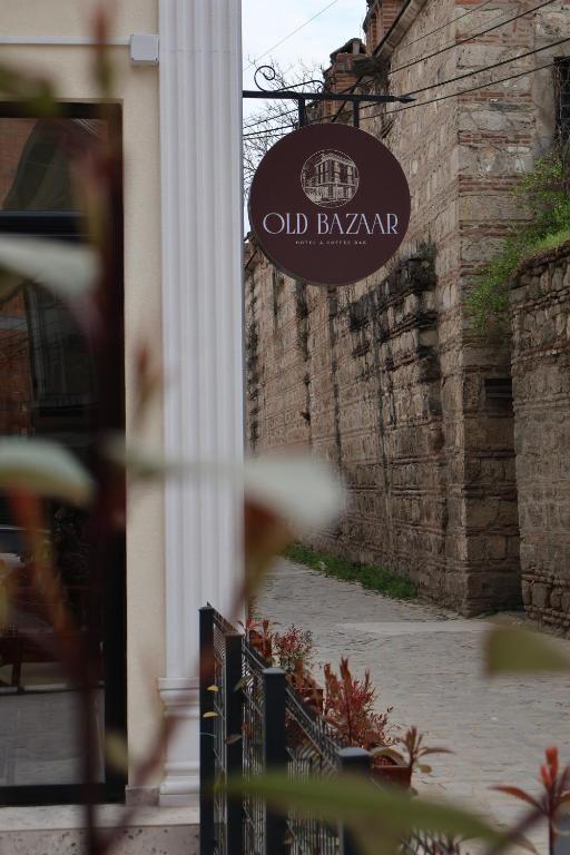 a sign that reads old barnyard on a building at Hotel and Coffee Bar Old Bazaar in Skopje