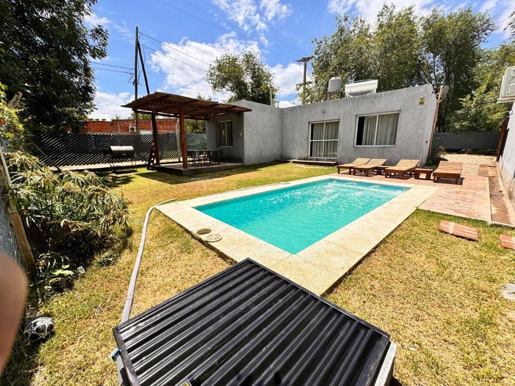 a swimming pool in the yard of a house at casa villa azul 1 in Tanti