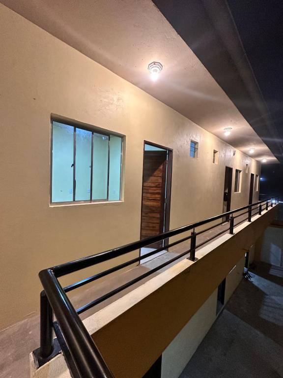 an empty hallway with a railing on a building at Visão do Céu in Viçosa do Ceará